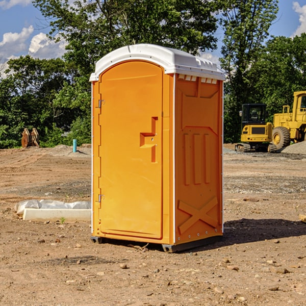 what is the cost difference between standard and deluxe portable restroom rentals in Hallock